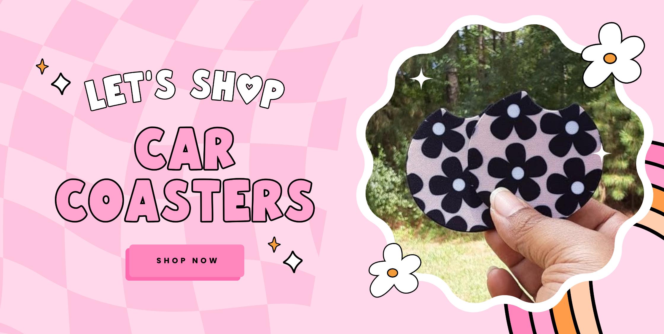 Banner promoting car coasters with the text "Let's Shop Car Coasters" and featuring a hand holding a set of black and white floral patterned coasters, encouraging visitors to shop now. The background is pink with a checkered pattern and flower illustrations.